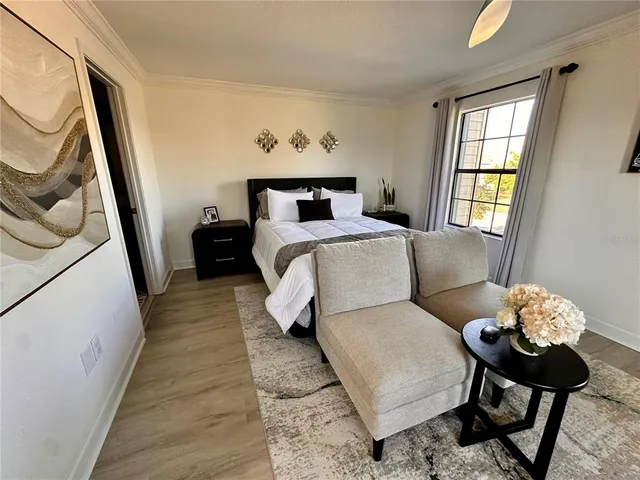 a bed room with furniture and a window