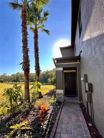 a view of a pathway with a yard