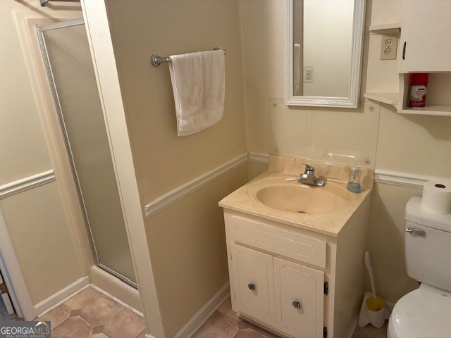 451 Underwood Road Milledgeville, GA 31061 - Photo 15 of 24 a bathroom with a sink toilet and mirror