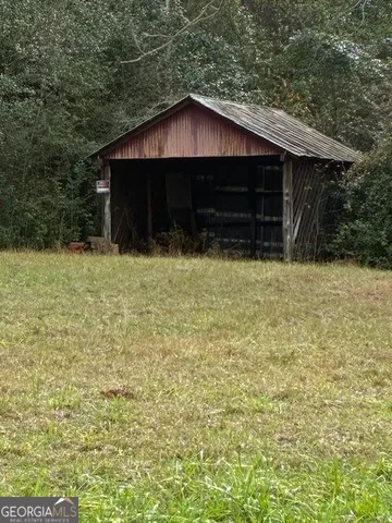 a couple of table and chairs under an umbrella