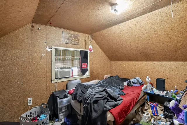 a bed room with a bed and a window