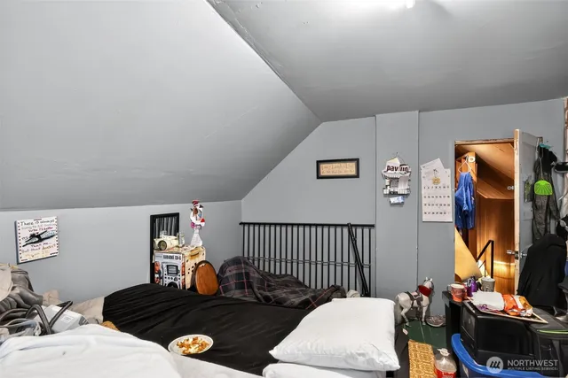 a bedroom with furniture and a window