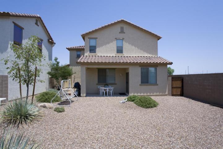 3815 East Chickadee Road Gilbert, AZ 85297 - Photo 6 of 9 a front view of a house with a garden