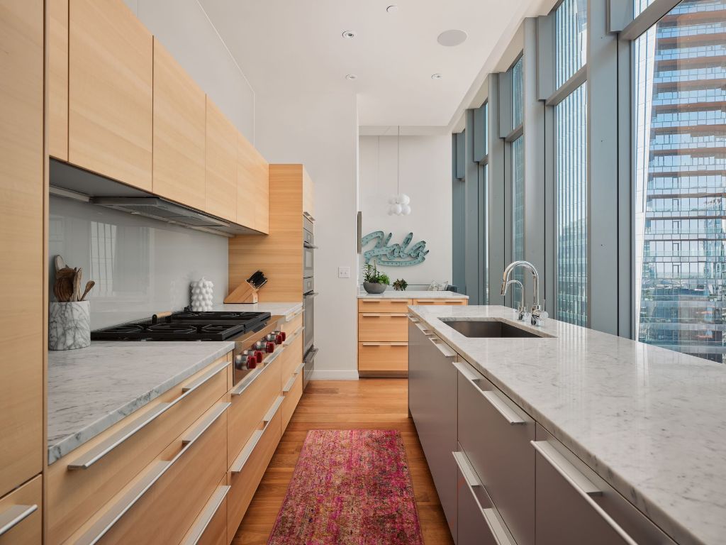 210 Lavaca Street, Unit 3504 Austin, TX 78701 - Photo 15 of 40 a kitchen with stainless steel appliances granite countertop a stove and a sink