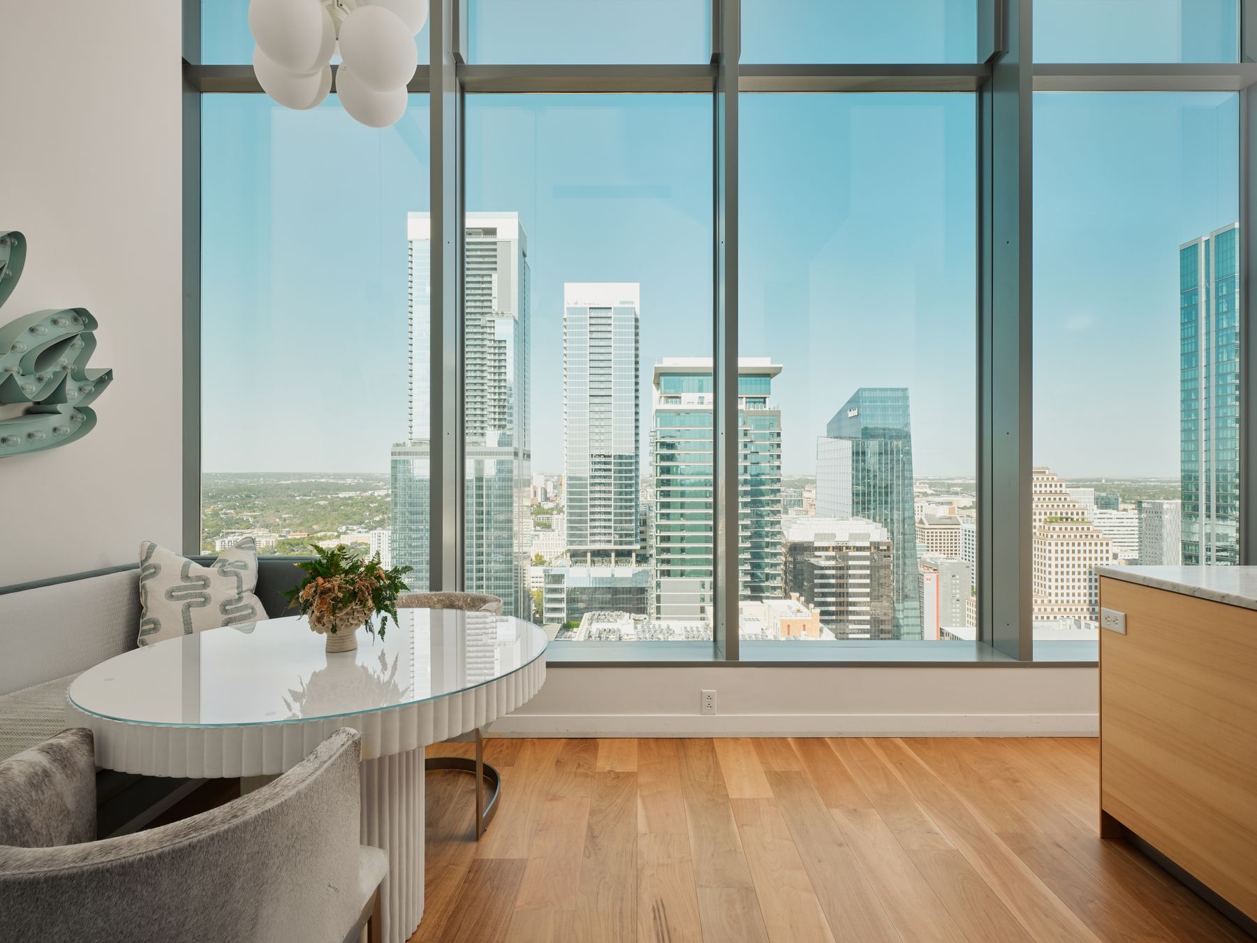 210 Lavaca Street, Unit 3504 Austin, TX 78701 - Photo 21 of 40 Dining area featuring light wood-style floors, healthy amount of natural light, and a view of city