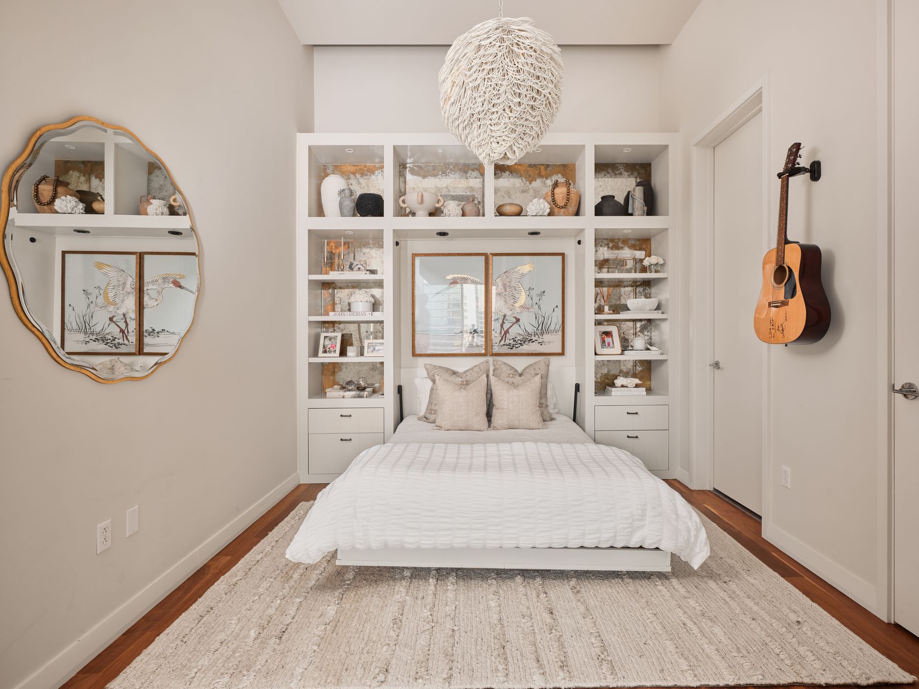 210 Lavaca Street, Unit 3504 Austin, TX 78701 - Photo 24 of 40 Bedroom with a chandelier and wood finished floors