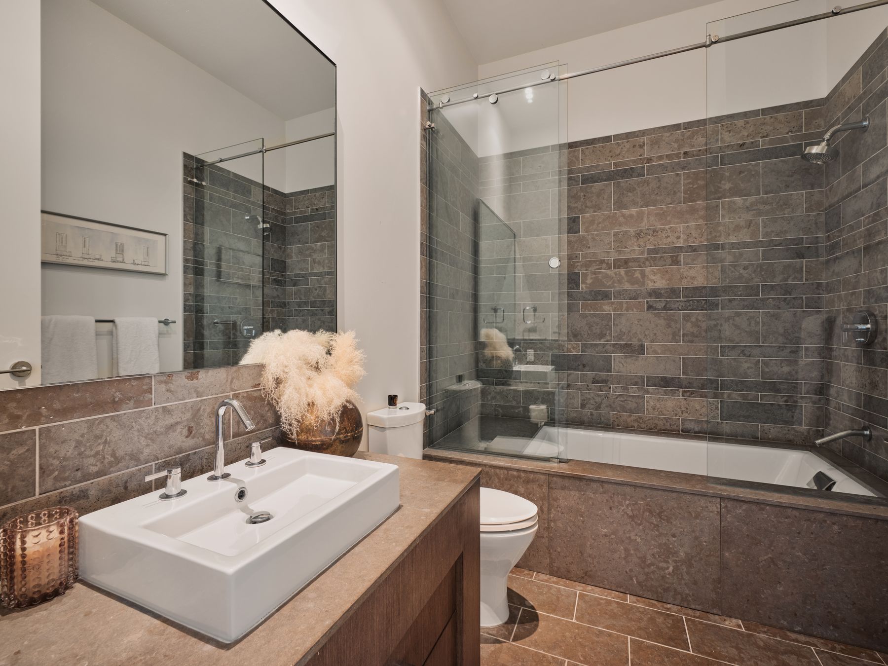 210 Lavaca Street, Unit 3504 Austin, TX 78701 - Photo 25 of 40 Bathroom with tiled shower / bath combo, vanity, dark tile patterned floors, and tasteful backsplash