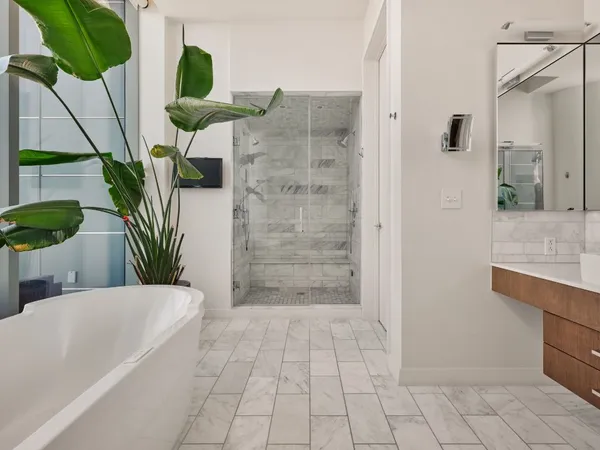 a white bath tub sitting next to a window