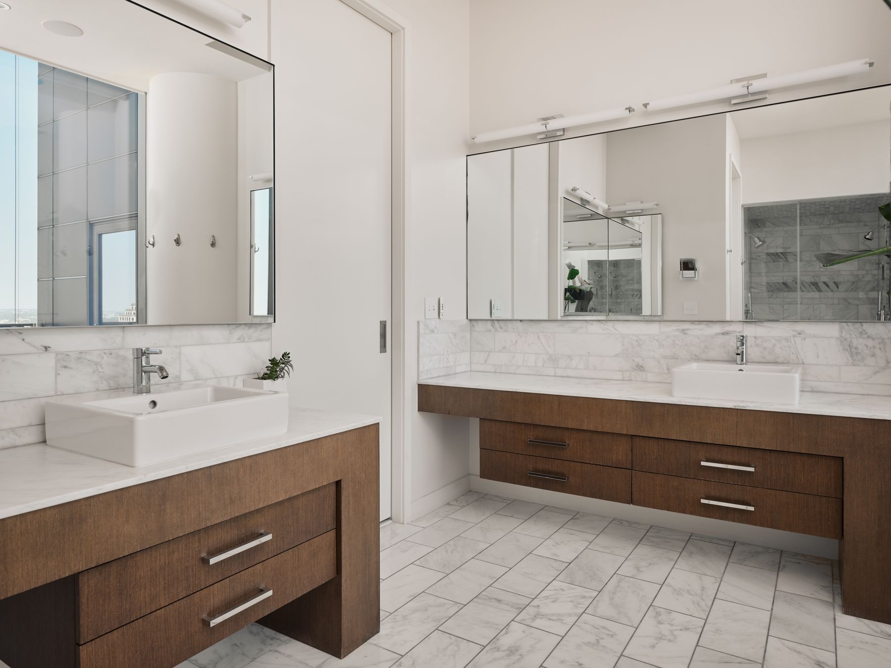 210 Lavaca Street, Unit 3504 Austin, TX 78701 - Photo 29 of 40 Full bath featuring two vanities, light marble finish flooring, and tasteful backsplash