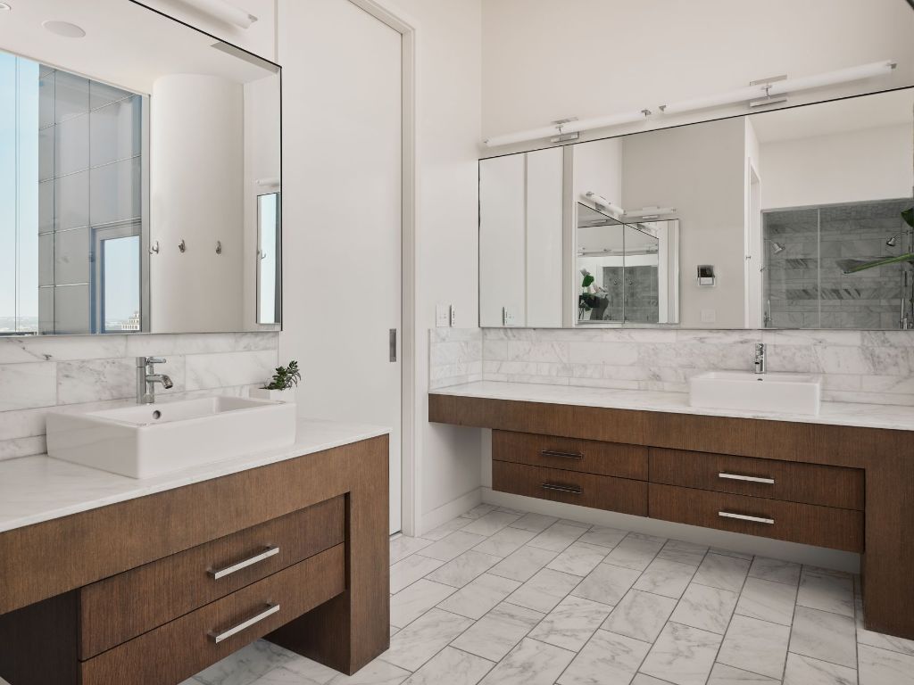 210 Lavaca Street, Unit 3504 Austin, TX 78701 - Photo 29 of 40 a bathroom with a sink and a mirror