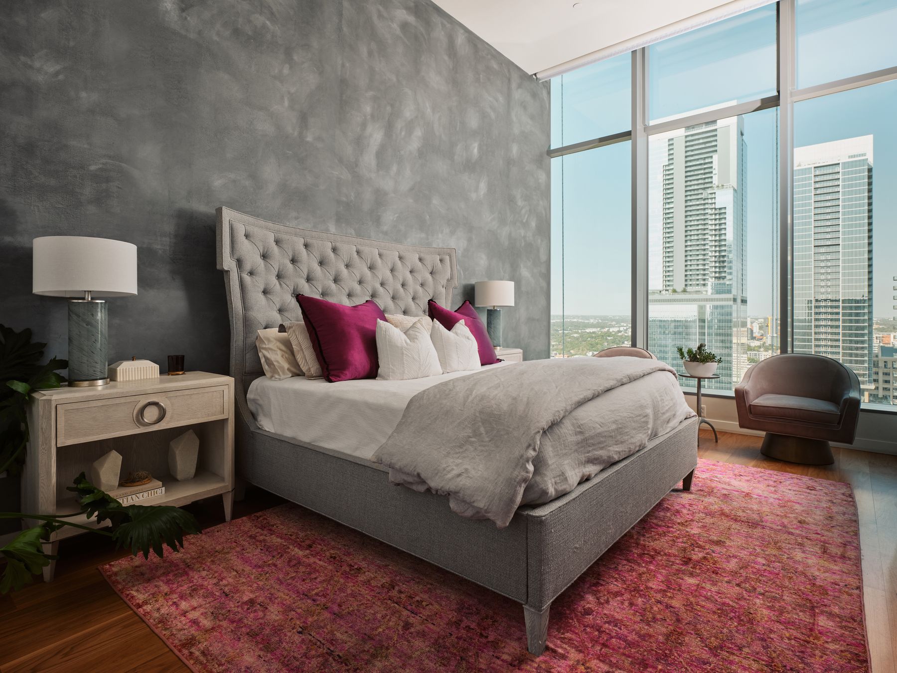 210 Lavaca Street, Unit 3504 Austin, TX 78701 - Photo 30 of 40 Bedroom with a wall of windows, wood finished floors, multiple windows, and a city view