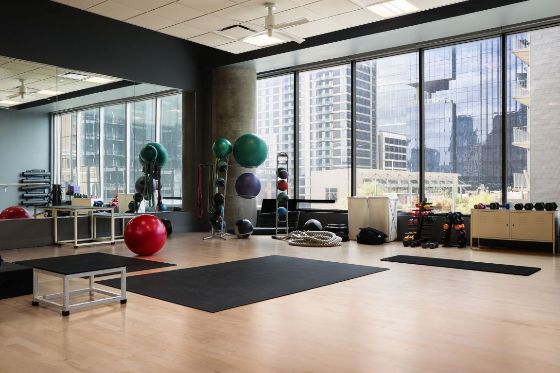 210 Lavaca Street, Unit 3504 Austin, TX 78701 - Photo 40 of 40 a room with gym equipment and large windows