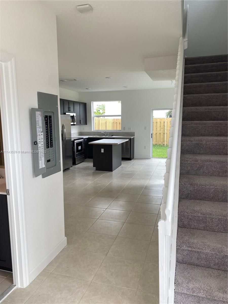Homestead Homestead, FL 33035 - Photo 5 of 11 a large kitchen with a window and stainless steel appliances