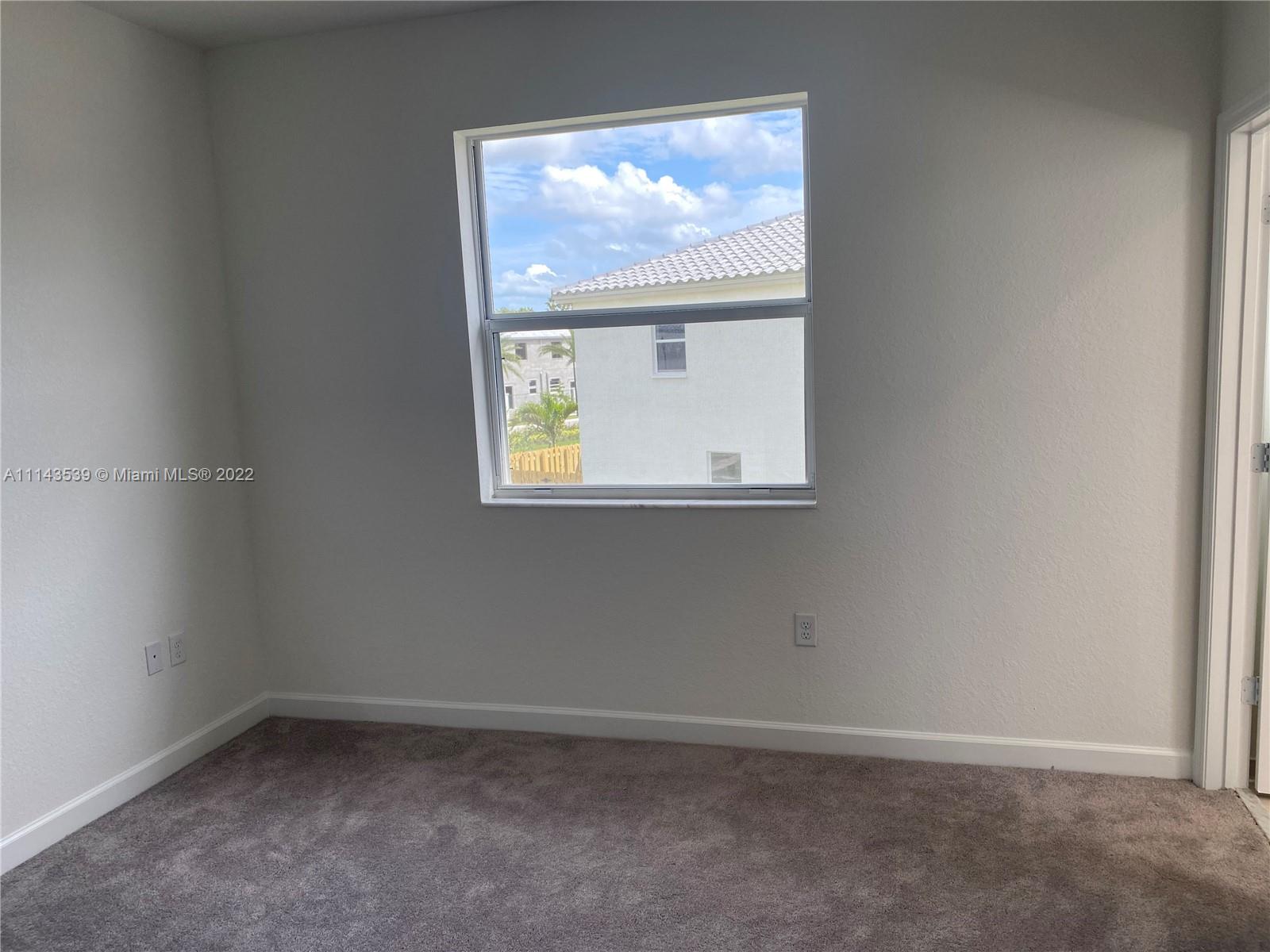 Homestead Homestead, FL 33035 - Photo 9 of 11 an empty room with a window