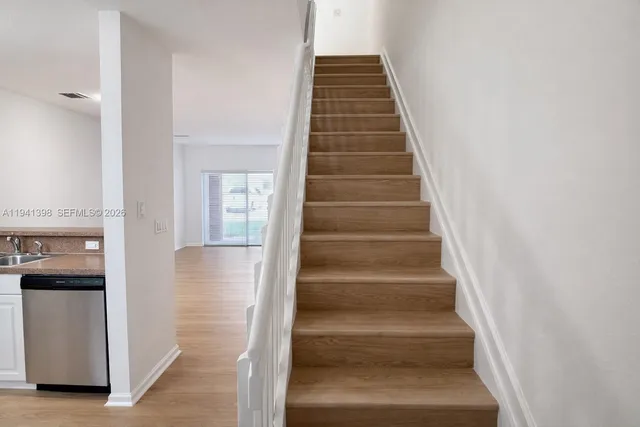 a view of staircase with white walls