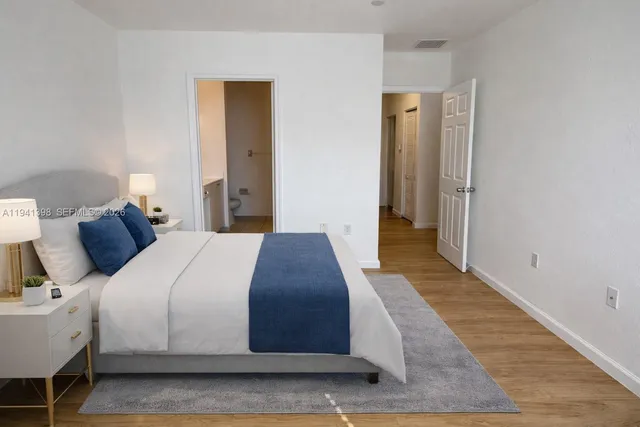 a bedroom with a bed and a table