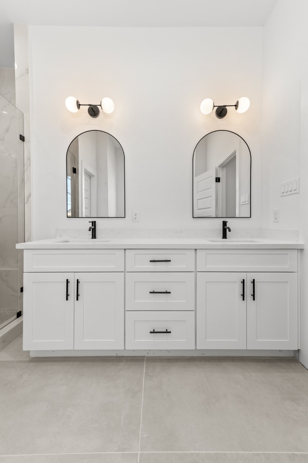 5903 Doolittle Boulevard Houston, TX 77033 - Photo 13 of 30 a bathroom with double vanity sink two mirror and window