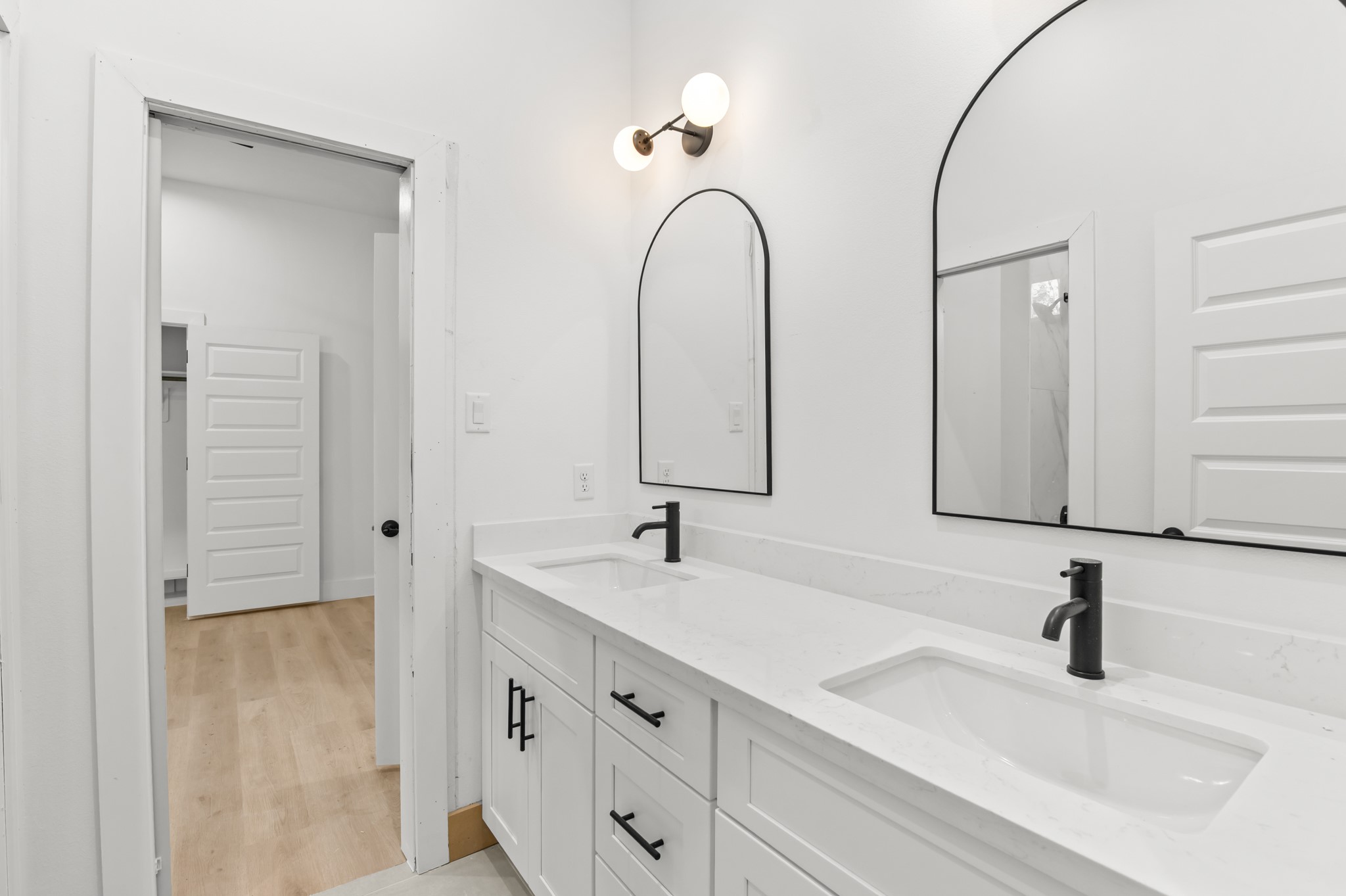 5903 Doolittle Boulevard Houston, TX 77033 - Photo 15 of 30 a bathroom with double vanity sinks and a mirror
