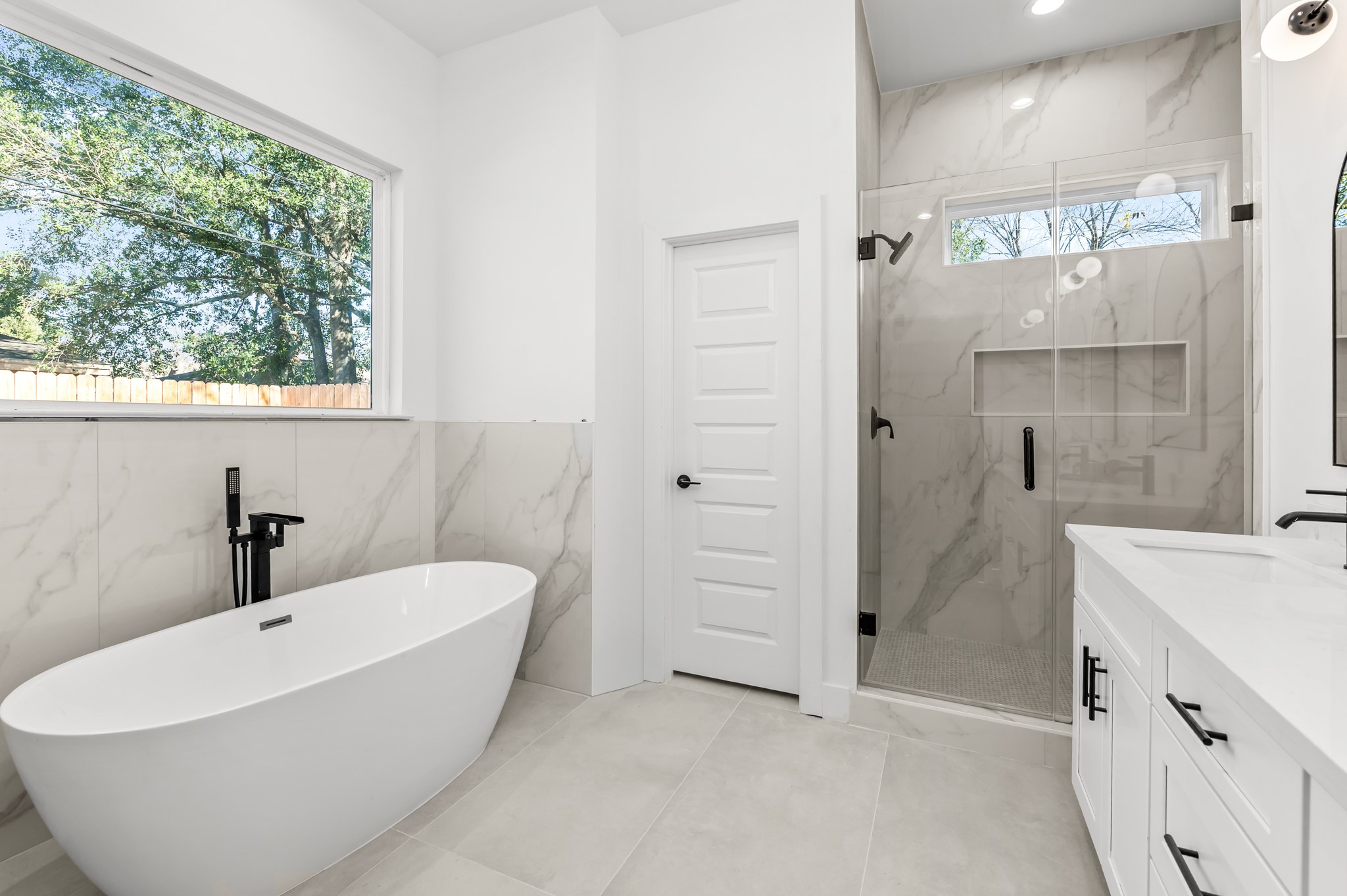 5903 Doolittle Boulevard Houston, TX 77033 - Photo 4 of 30 a bathroom with a bathtub and a sink