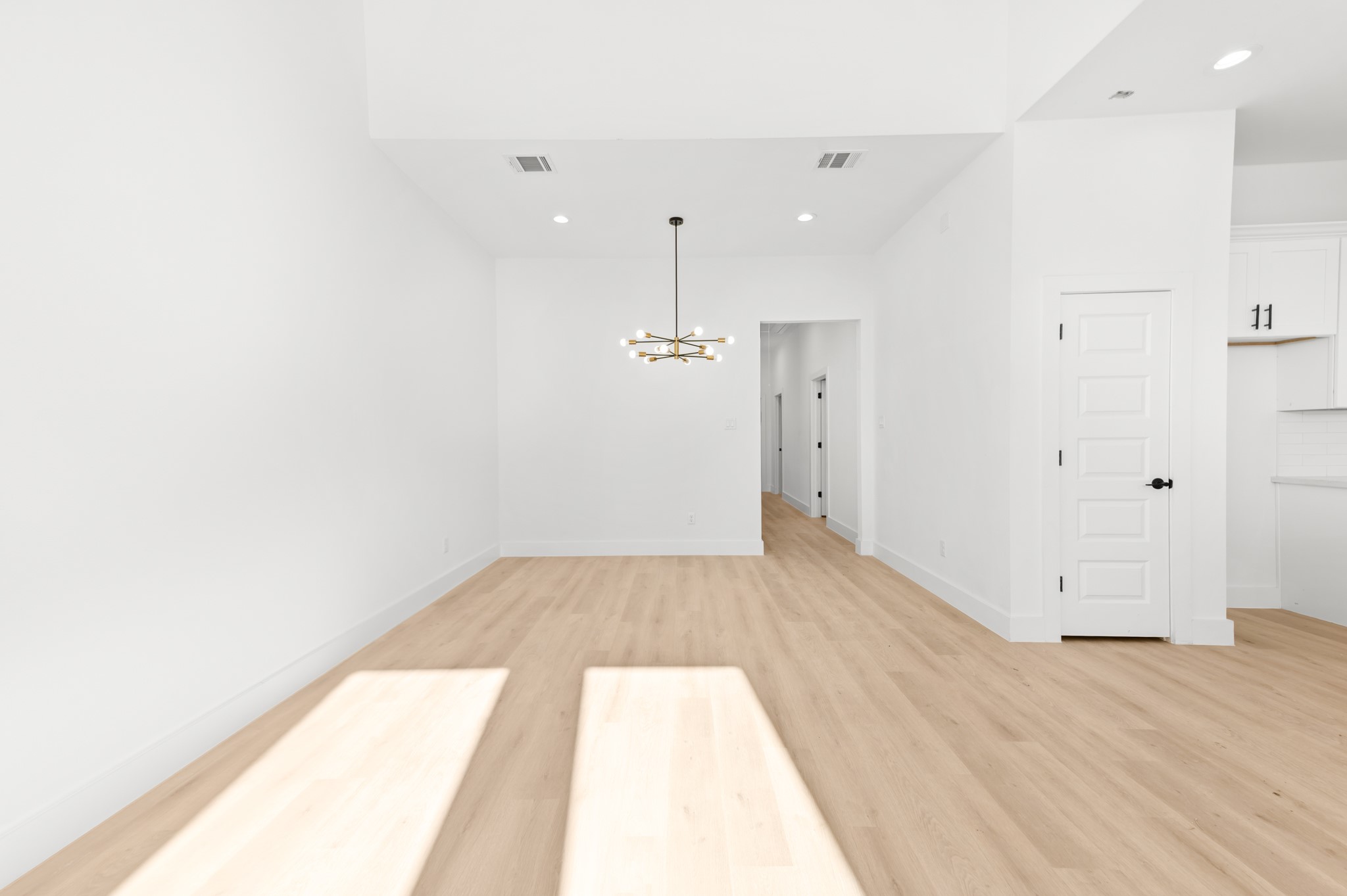 5903 Doolittle Boulevard Houston, TX 77033 - Photo 7 of 30 a view of a room with wooden floor and white doors