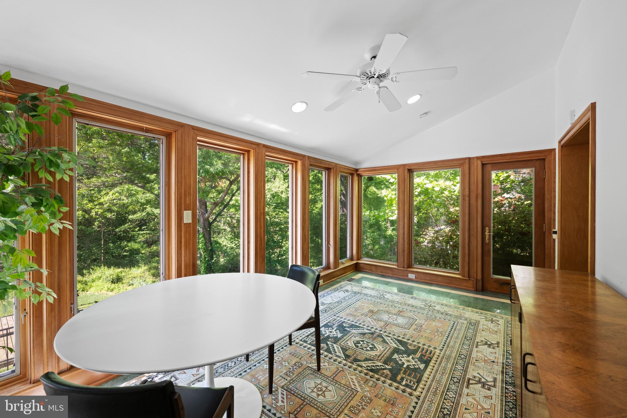 1702 Kalmia Road Northwest Washington, DC 20012 - Photo 14 of 55 a view of a dining room with furniture window and wooden floor