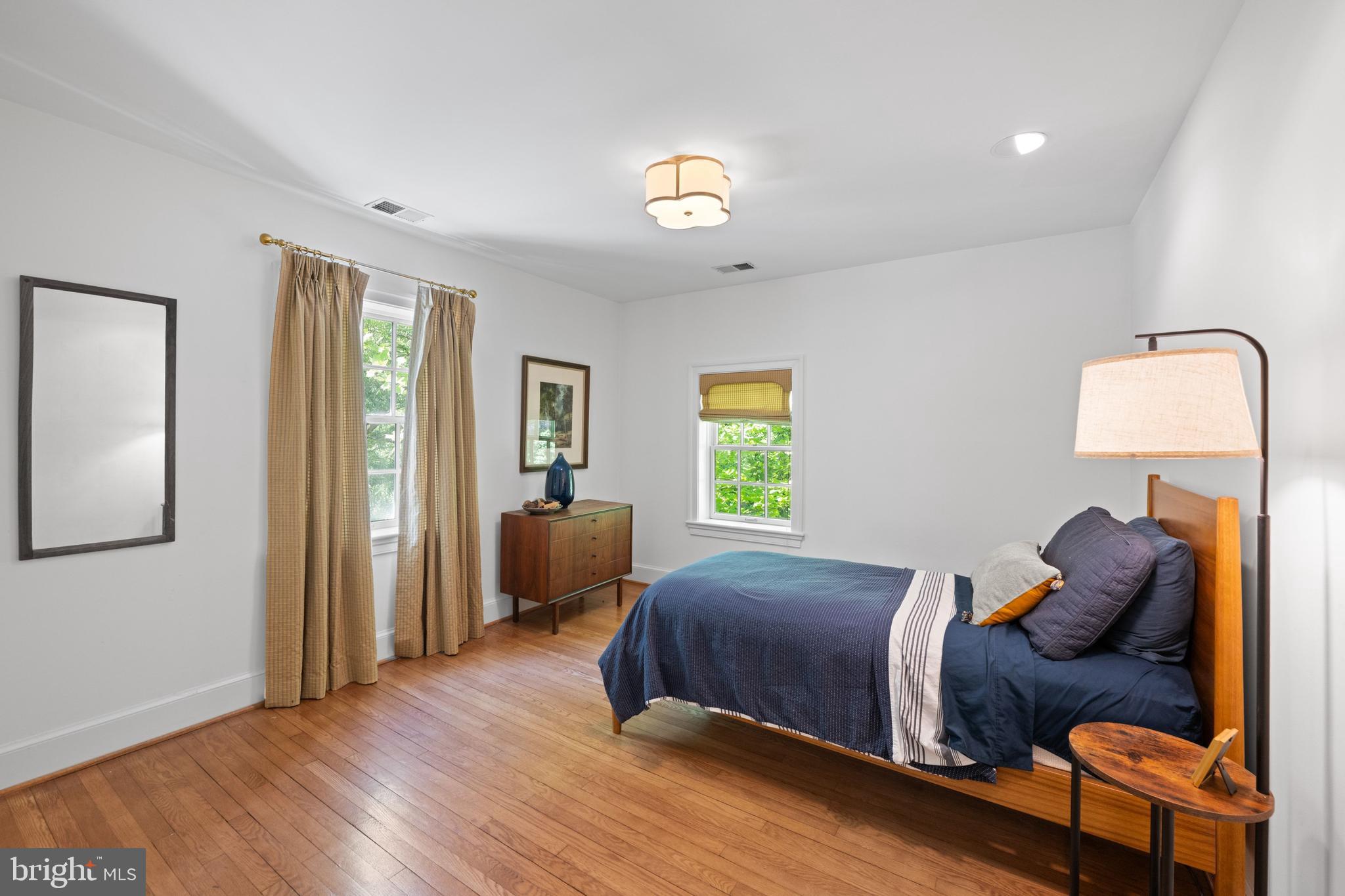 1702 Kalmia Road Northwest Washington, DC 20012 - Photo 26 of 55 a bedroom with a bed and wooden floor