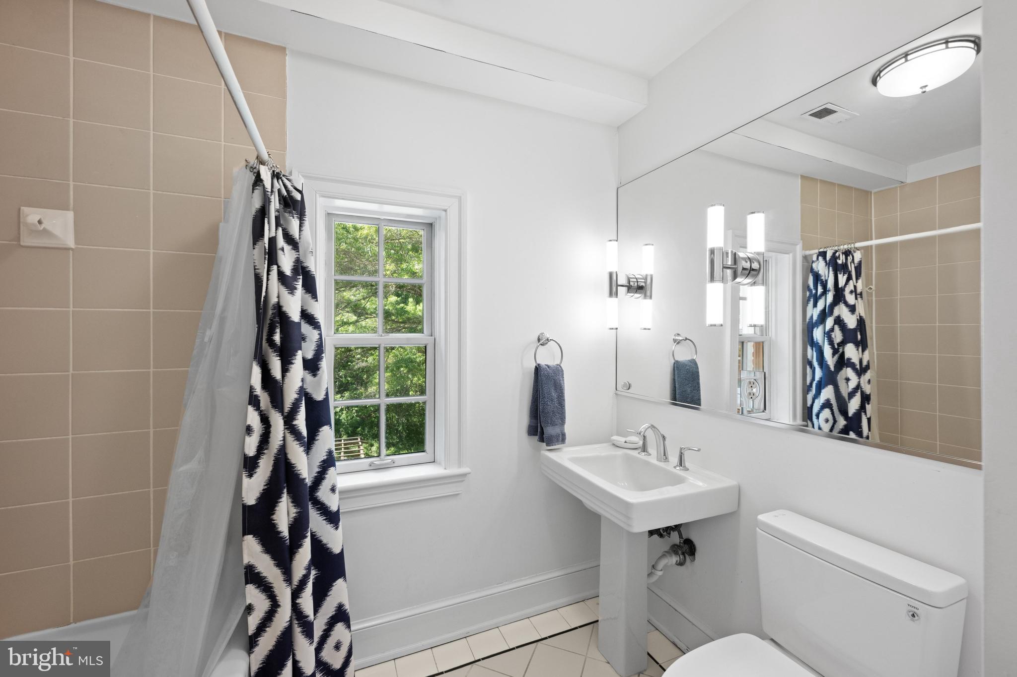 1702 Kalmia Road Northwest Washington, DC 20012 - Photo 28 of 55 a bathroom with a sink toilet and shower