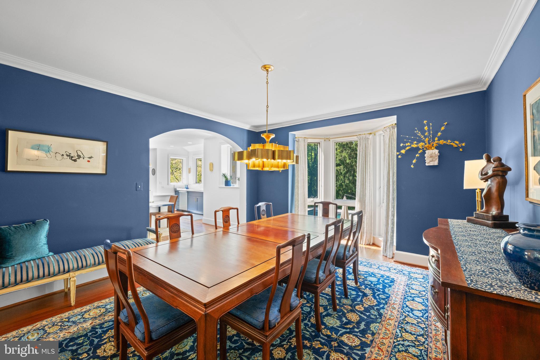 1702 Kalmia Road Northwest Washington, DC 20012 - Photo 10 of 55 a dining room with furniture a chandelier and wooden floor
