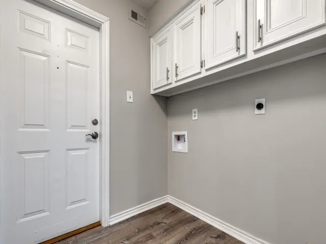 a view of cabinets and wooden floor