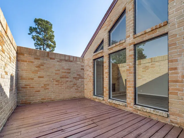 a view of outdoor space and wooden deck