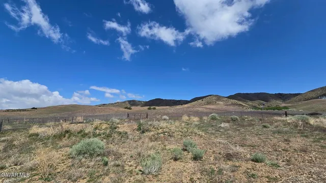 a view of mountain with sunset
