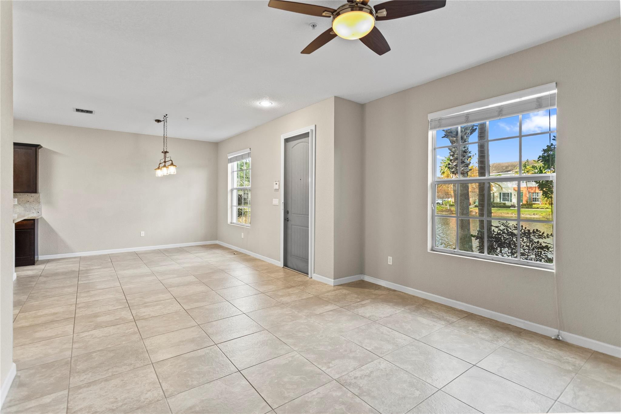 259 Southwest 7th Street, Unit 259 Pompano Beach, FL 33060 - Photo 18 of 87 a view of an empty room with a window