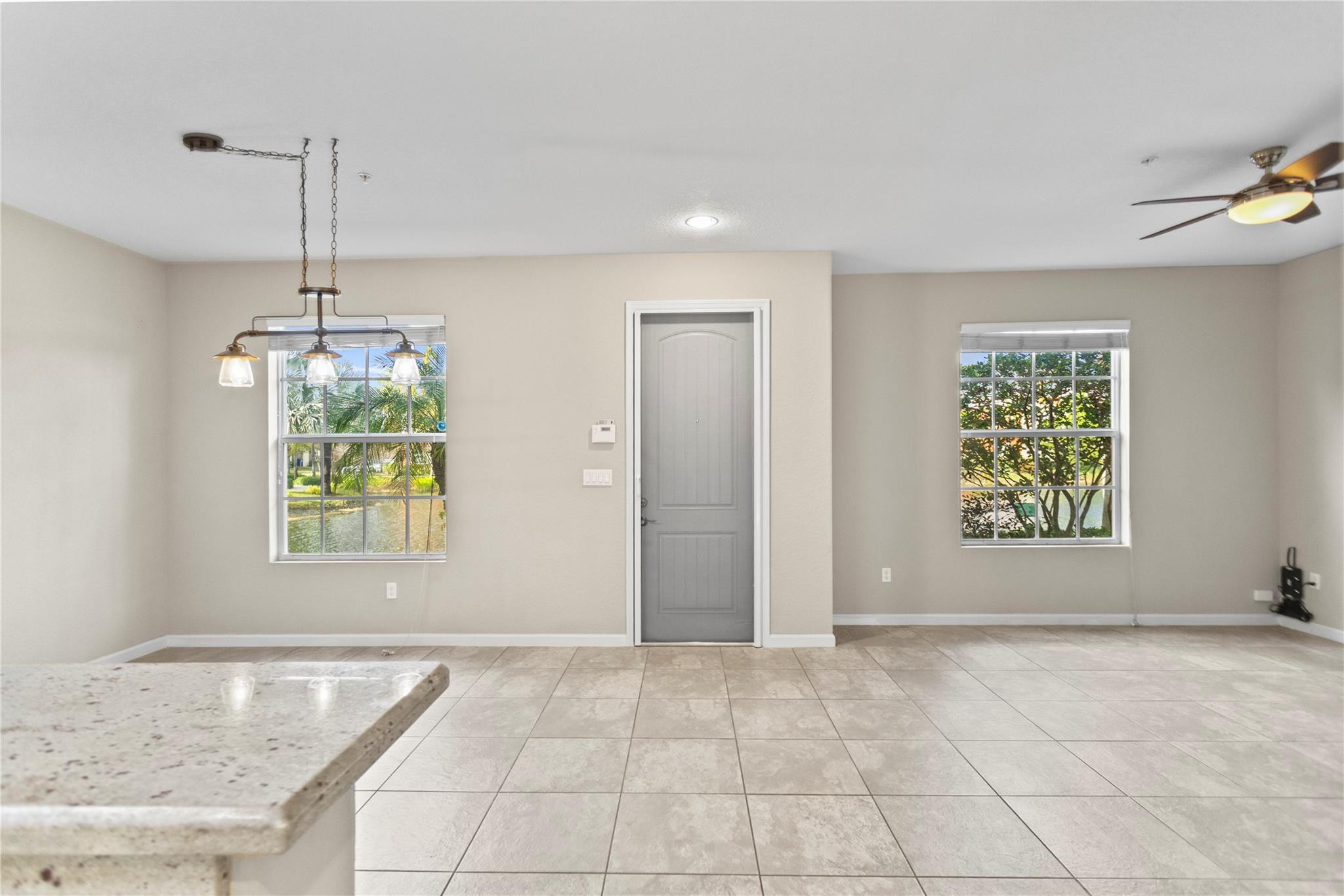 259 Southwest 7th Street, Unit 259 Pompano Beach, FL 33060 - Photo 19 of 87 wooden floor in an empty room with a window