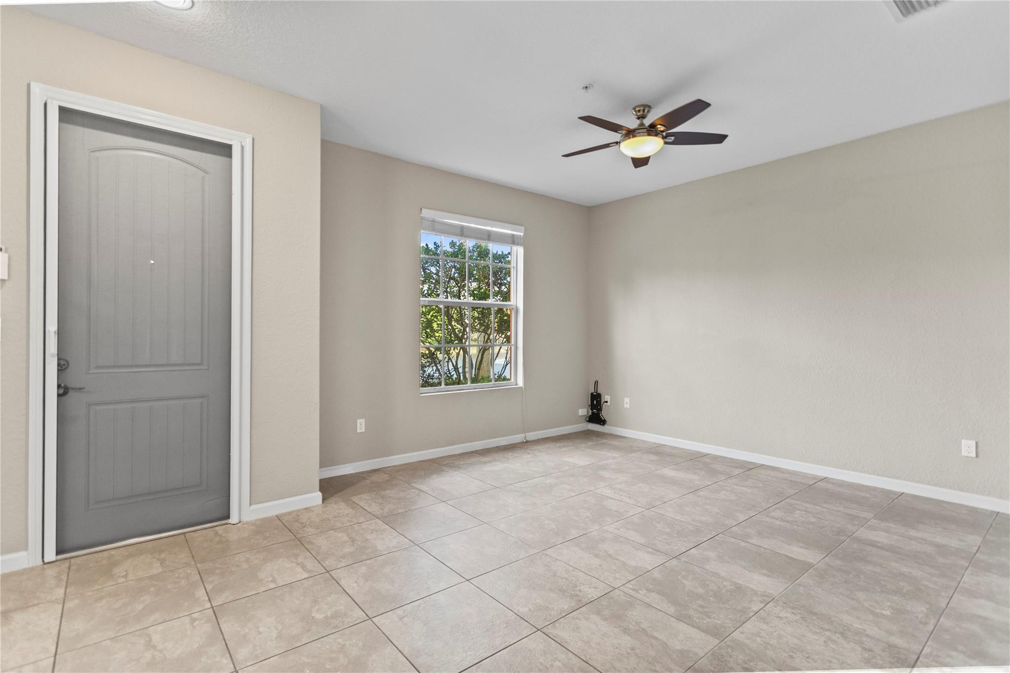 259 Southwest 7th Street, Unit 259 Pompano Beach, FL 33060 - Photo 20 of 87 a view of an empty room with a window