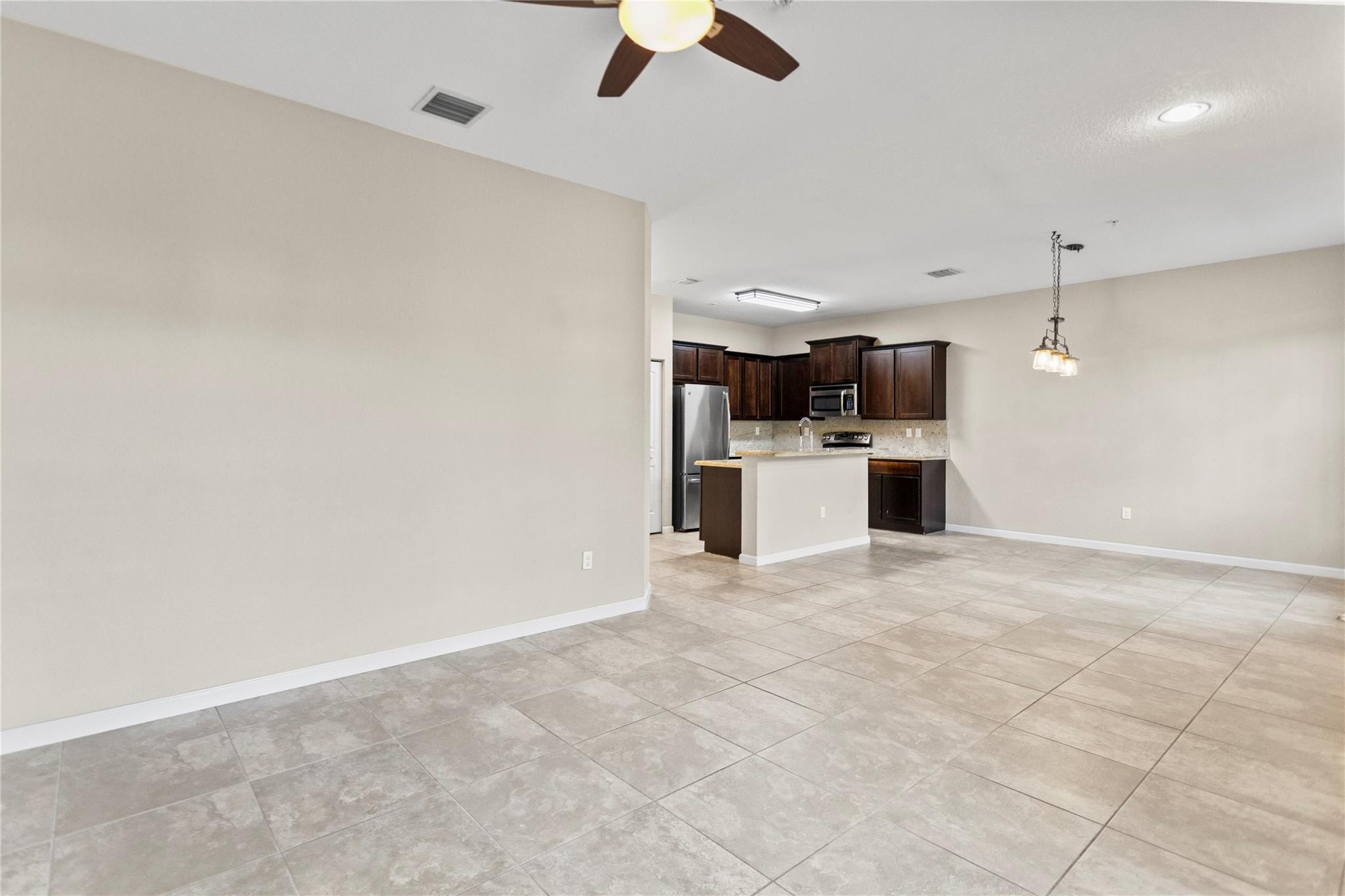 259 Southwest 7th Street, Unit 259 Pompano Beach, FL 33060 - Photo 22 of 87 a view of a kitchen with a sink and a stove top oven