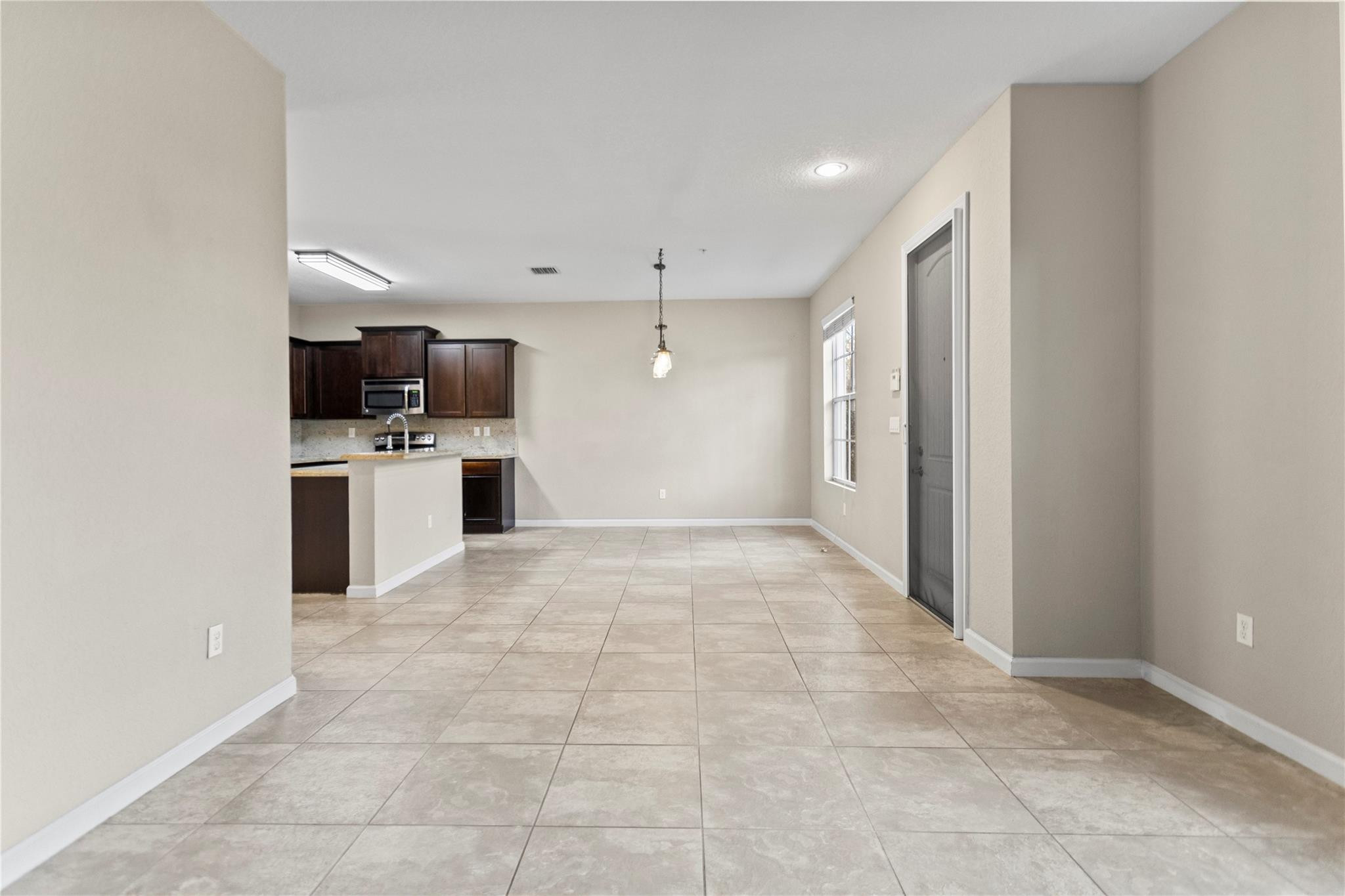 259 Southwest 7th Street, Unit 259 Pompano Beach, FL 33060 - Photo 23 of 87 a view of a kitchen with a sink and a refrigerator