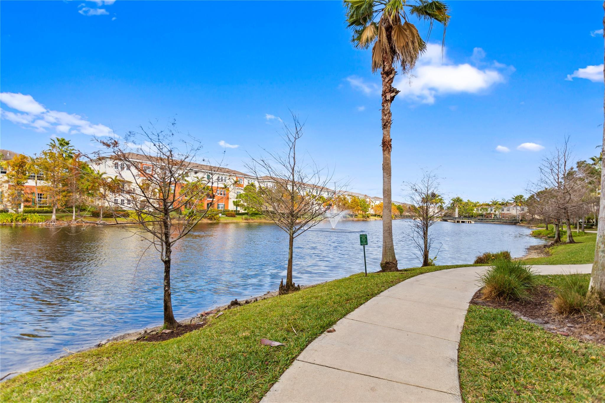 259 Southwest 7th Street, Unit 259 Pompano Beach, FL 33060 - Photo 30 of 87 a front view of a house with a yard and lake view