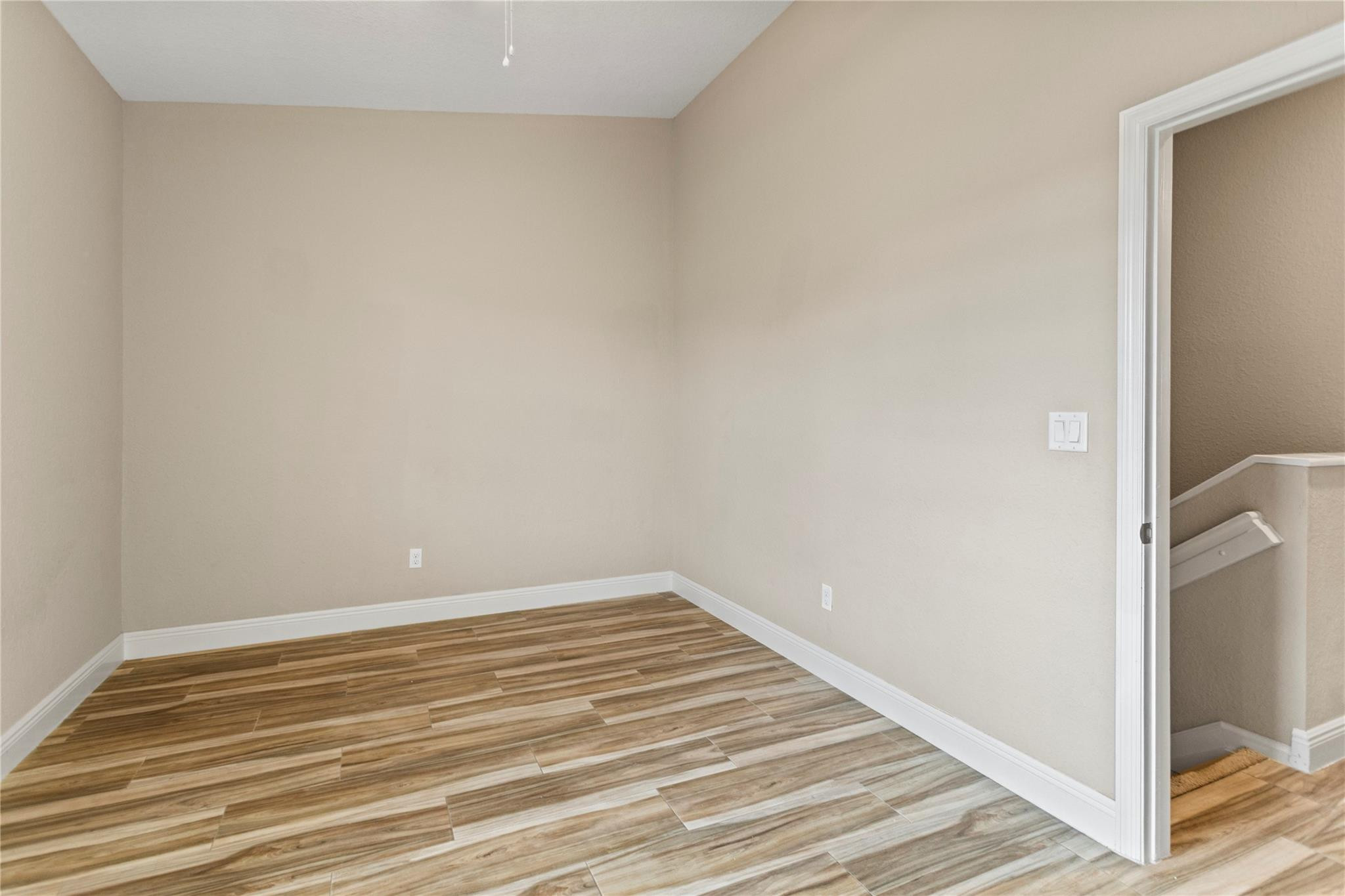 259 Southwest 7th Street, Unit 259 Pompano Beach, FL 33060 - Photo 39 of 87 a view of a room with wooden floor and bench