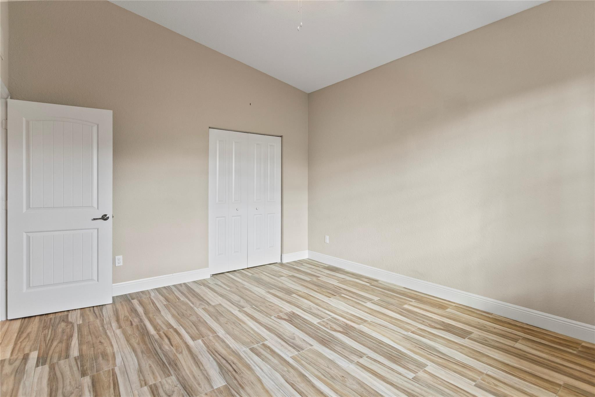 259 Southwest 7th Street, Unit 259 Pompano Beach, FL 33060 - Photo 41 of 87 a view of room with wooden floor