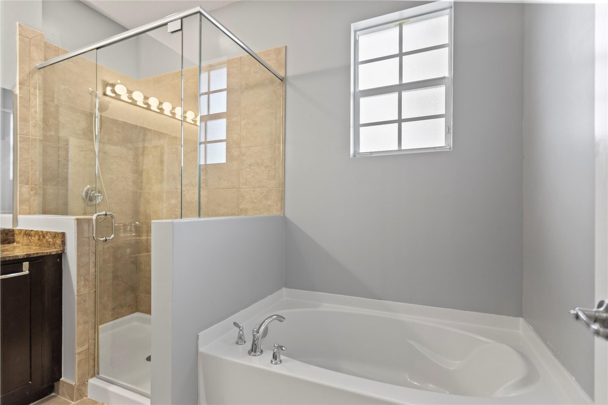 259 Southwest 7th Street, Unit 259 Pompano Beach, FL 33060 - Photo 50 of 87 a bathroom with a bathtub and a shower