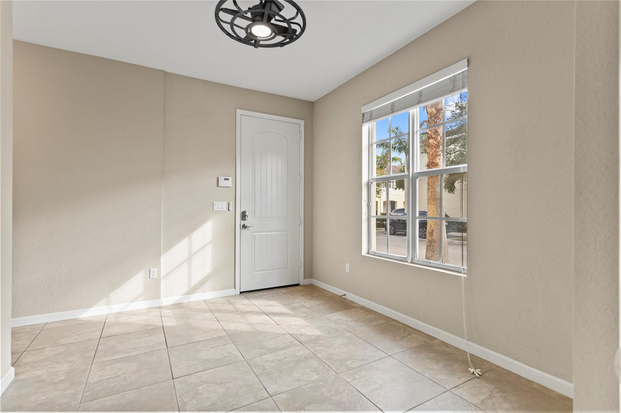 259 Southwest 7th Street, Unit 259 Pompano Beach, FL 33060 - Photo 5 of 87 a view of an empty room with a window