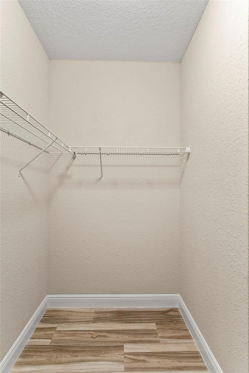 259 Southwest 7th Street, Unit 259 Pompano Beach, FL 33060 - Photo 51 of 87 a view of a room with racks on the wall