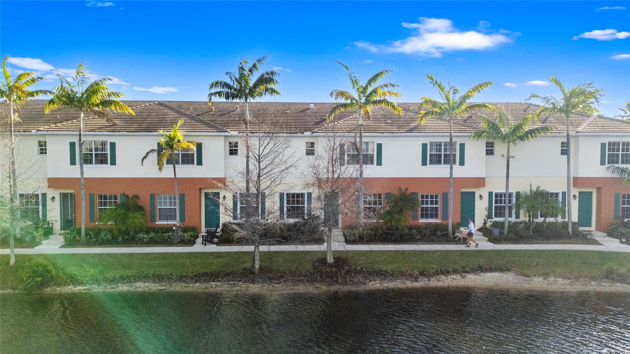 259 Southwest 7th Street, Unit 259 Pompano Beach, FL 33060 - Photo 61 of 87 a front view of a house with a garden