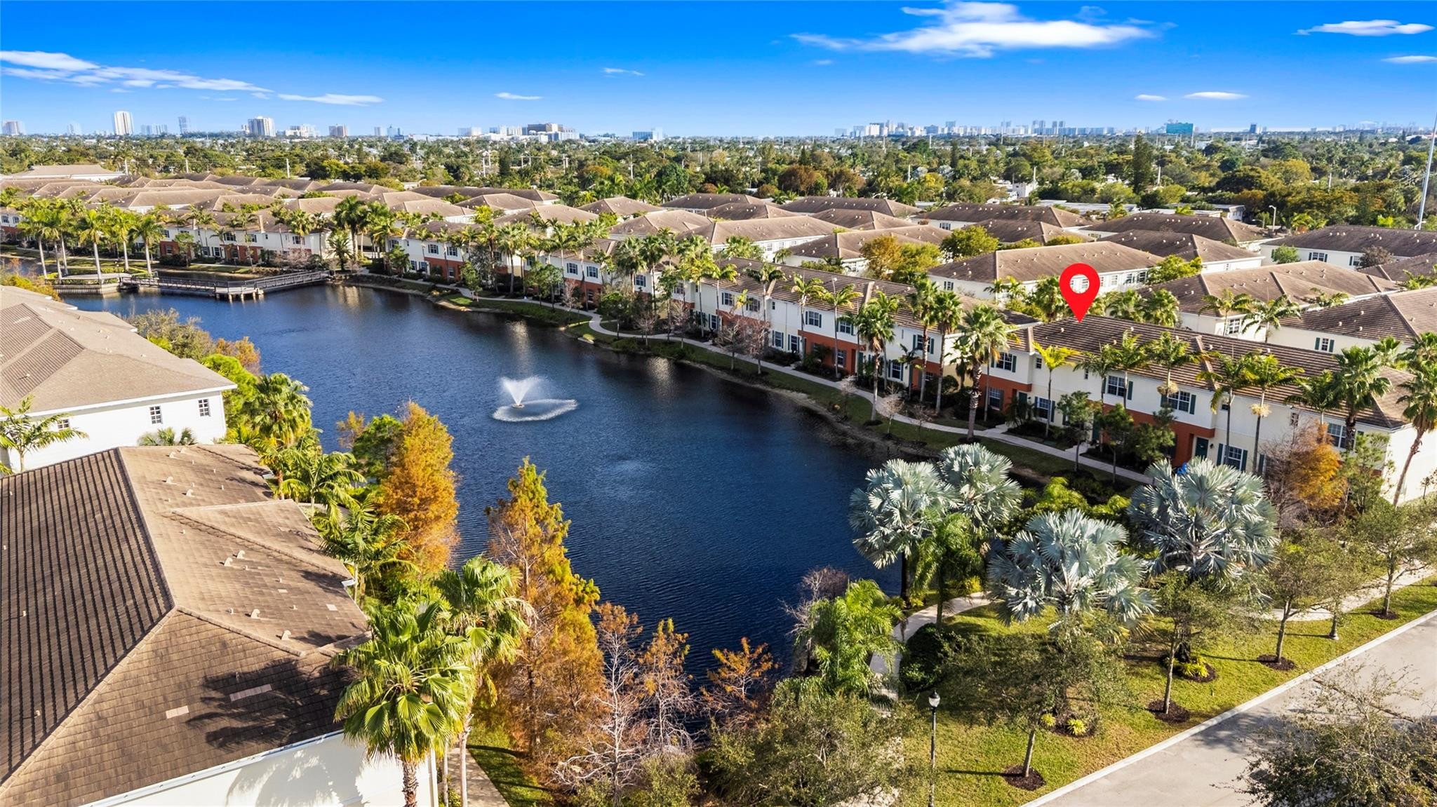 259 Southwest 7th Street, Unit 259 Pompano Beach, FL 33060 - Photo 66 of 87 an aerial view of residential houses with outdoor space and swimming pool