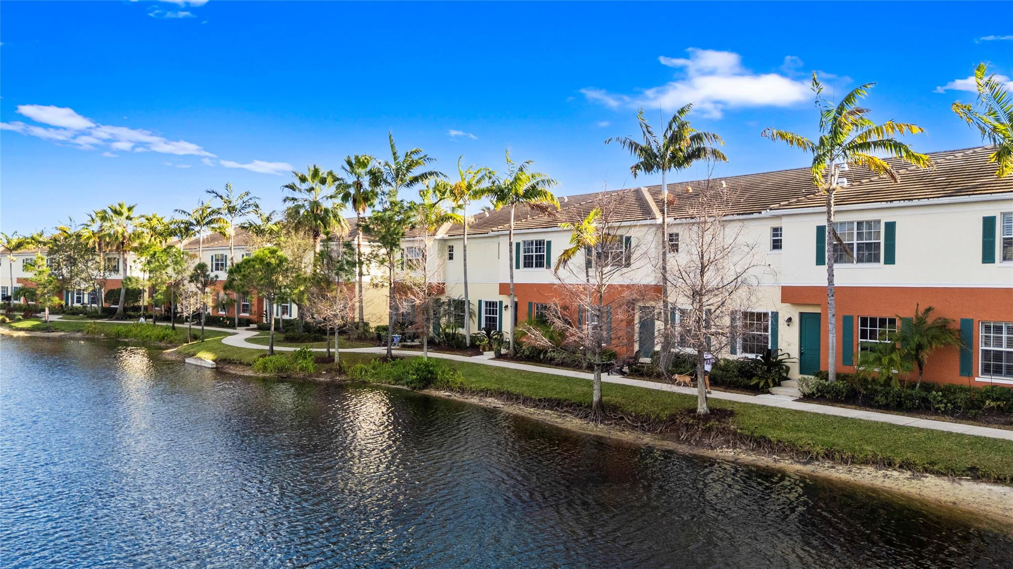 259 Southwest 7th Street, Unit 259 Pompano Beach, FL 33060 - Photo 68 of 87 a view of a house with a yard and a pond