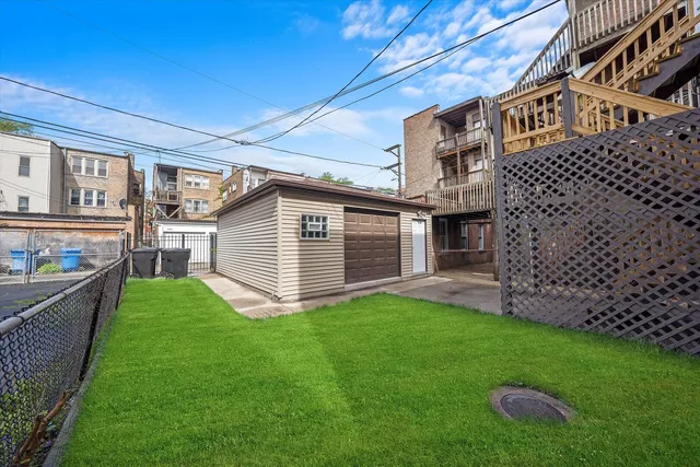a view of a house with a yard and pathway