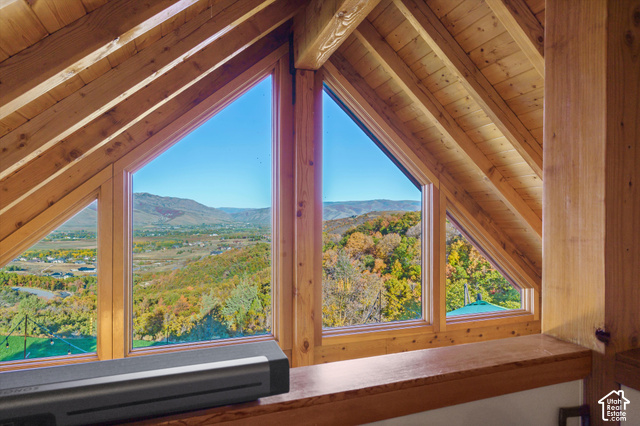 5878 Snowbasin Road Huntsville, UT 84317 - Photo 31 of 90 Exposed wood beams and ceiling with multiple triangular windows framing a mountainous landscape