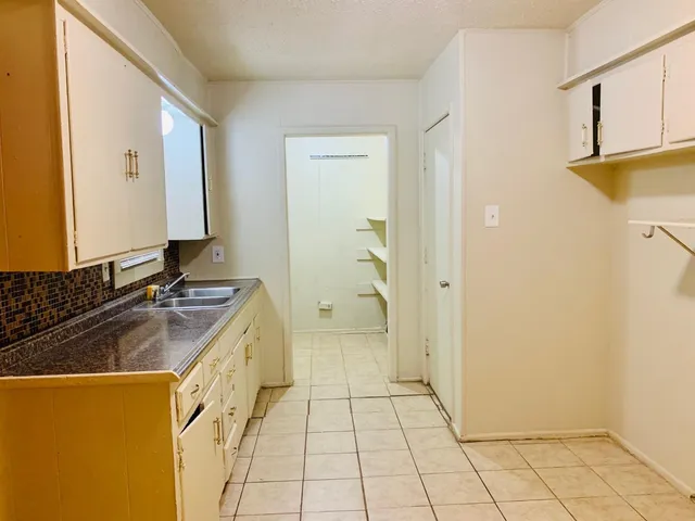 a bathroom with a sink a mirror and a shower