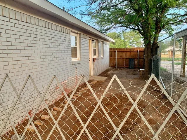 an outdoor space with a backyard