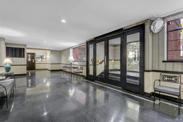 a lobby with furniture and window